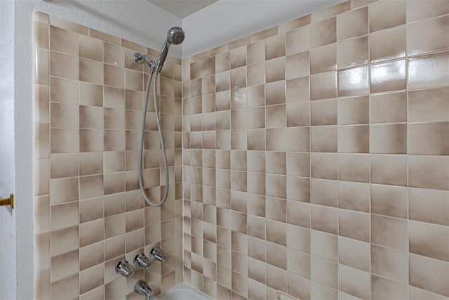 3116 SW 96th St, Oklahoma City, OK 73159 - bathroom with bathing tub / shower combination and a textured wall
