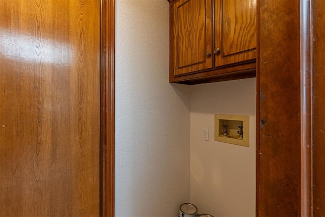 3116 SW 96th St, Oklahoma City, OK 73159 - washroom featuring cabinet space, hookup for a washing machine, and a textured wall