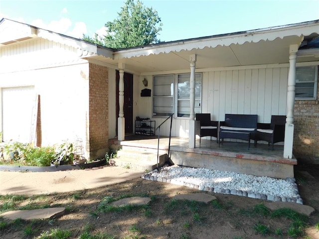 2236 Highland Rd, Oklahoma City, OK 73110 - view of exterior entry with covered porch and brick siding