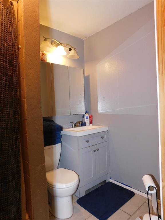 2236 Highland Rd, Oklahoma City, OK 73110 - bathroom featuring tile patterned flooring, vanity, and curtained shower