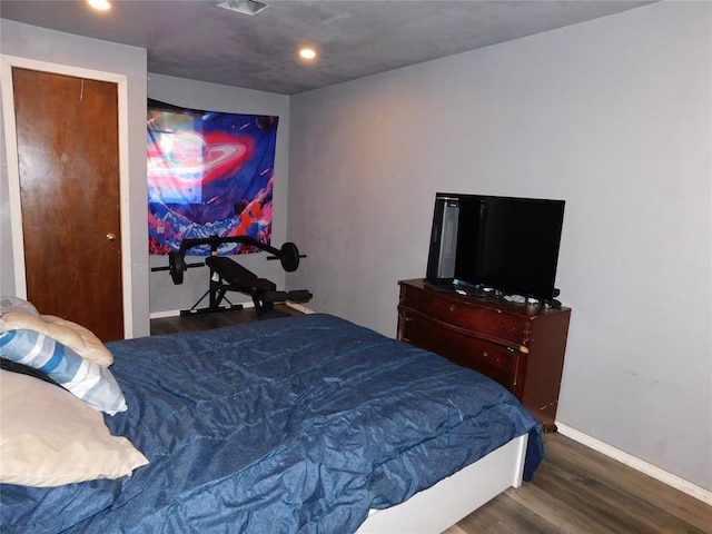 2236 Highland Rd, Oklahoma City, OK 73110 - bedroom featuring wood finished floors and recessed lighting