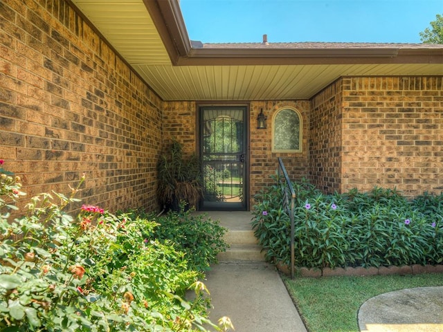 924 Penn Ln, Moore, OK 73160 - property entrance with brick siding and a porch