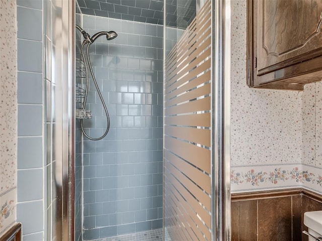 924 Penn Ln, Moore, OK 73160 - bathroom featuring a shower stall, radiator heating unit, a wainscoted wall, and wallpapered walls