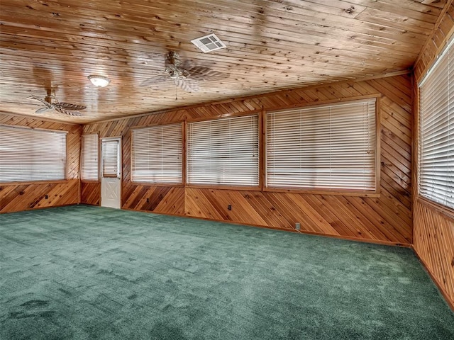 924 Penn Ln, Moore, OK 73160 - unfurnished room with wooden walls, carpet flooring, wood ceiling, ceiling fan, and healthy amount of natural light