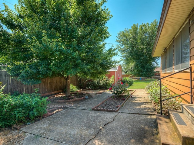 924 Penn Ln, Moore, OK 73160 - fenced backyard with a patio and an outdoor structure
