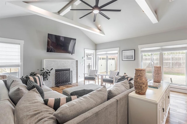 833 Gathering Leaves Way Unit 9183810100, Edmond, OK 73034 - living area featuring ceiling fan, light wood-style flooring, beam ceiling, plenty of natural light, and high vaulted ceiling