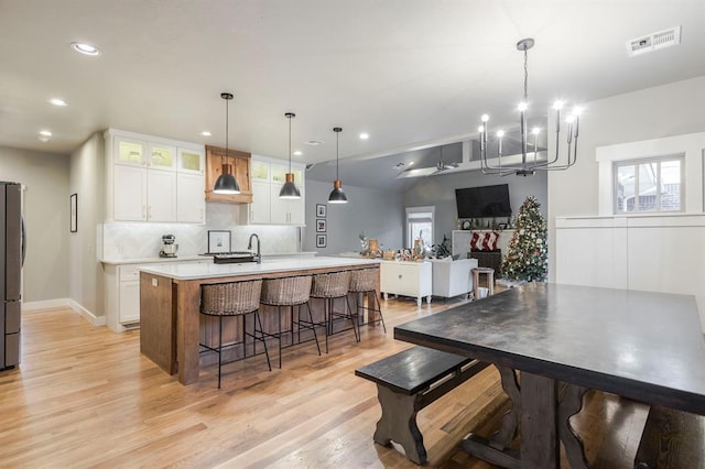 833 Gathering Leaves Way Unit 9183810100, Edmond, OK 73034 - dining room featuring light wood-type flooring, a chandelier, recessed lighting, and lofted ceiling