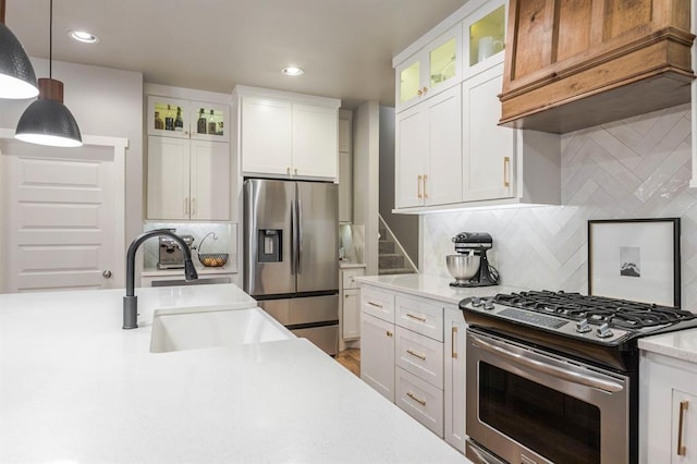 833 Gathering Leaves Way Unit 9183810100, Edmond, OK 73034 - kitchen with appliances with stainless steel finishes, pendant lighting, white cabinetry, backsplash, and recessed lighting