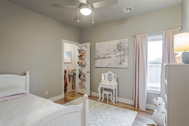 833 Gathering Leaves Way Unit 9183810100, Edmond, OK 73034 - bedroom featuring light wood-style flooring and a ceiling fan