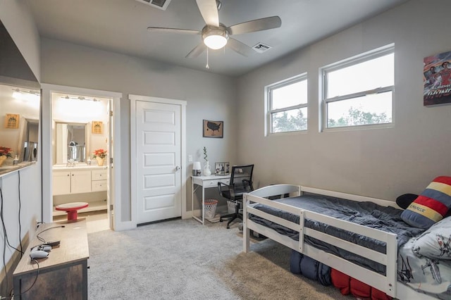 833 Gathering Leaves Way Unit 9183810100, Edmond, OK 73034 - bedroom with light colored carpet, an office area, ensuite bath, and a ceiling fan
