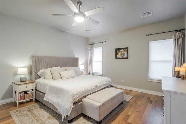 833 Gathering Leaves Way Unit 9183810100, Edmond, OK 73034 - bedroom featuring wood finished floors and a ceiling fan