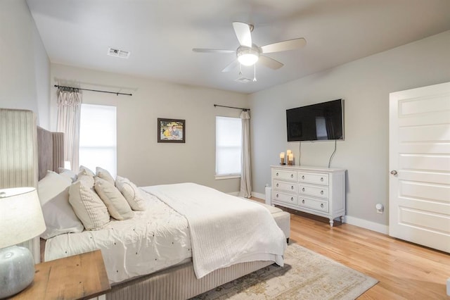 833 Gathering Leaves Way Unit 9183810100, Edmond, OK 73034 - bedroom with light wood-style flooring and ceiling fan