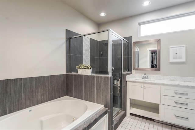 833 Gathering Leaves Way Unit 9183810100, Edmond, OK 73034 - full bathroom featuring a shower stall, a jetted tub, vanity, tile patterned floors, and recessed lighting