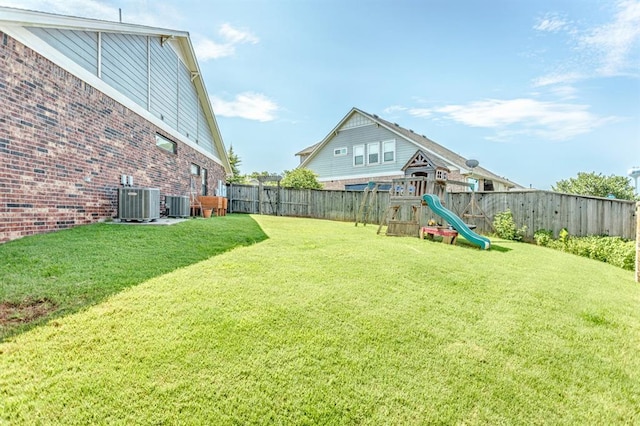 833 Gathering Leaves Way Unit 9183810100, Edmond, OK 73034 - fenced backyard featuring a playground