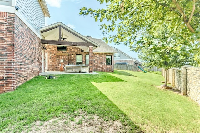 833 Gathering Leaves Way Unit 9183810100, Edmond, OK 73034 - fenced backyard featuring ceiling fan, a playground, and a patio area