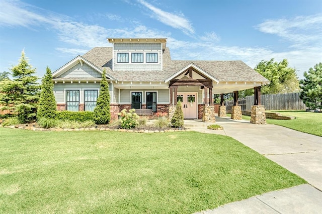 833 Gathering Leaves Way Unit 9183810100, Edmond, OK 73034 - craftsman-style home featuring concrete driveway, brick siding, an attached carport, and a shingled roof