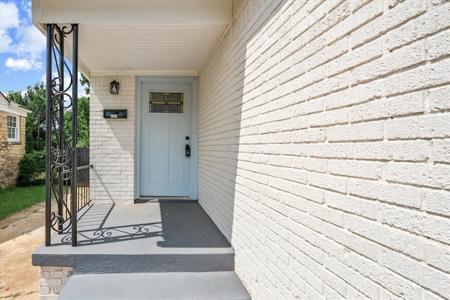 2525 NW 32nd St, Oklahoma City, OK 73112 - doorway to property featuring brick siding