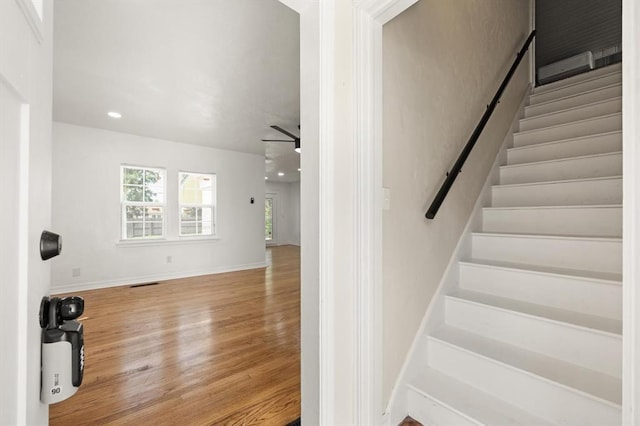 2525 NW 32nd St, Oklahoma City, OK 73112 - stairs featuring wood finished floors, ceiling fan, and recessed lighting