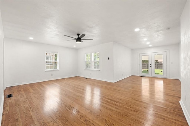 2525 NW 32nd St, Oklahoma City, OK 73112 - unfurnished living room with a ceiling fan, light wood-style floors, recessed lighting, and french doors