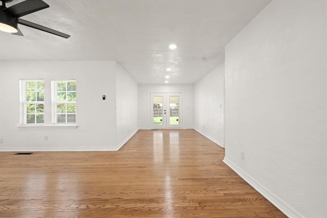 2525 NW 32nd St, Oklahoma City, OK 73112 - unfurnished living room with wood finished floors, ceiling fan, french doors, and recessed lighting