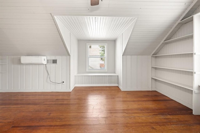 2525 NW 32nd St, Oklahoma City, OK 73112 - bonus room featuring hardwood / wood-style floors, a wall mounted AC, and a ceiling fan