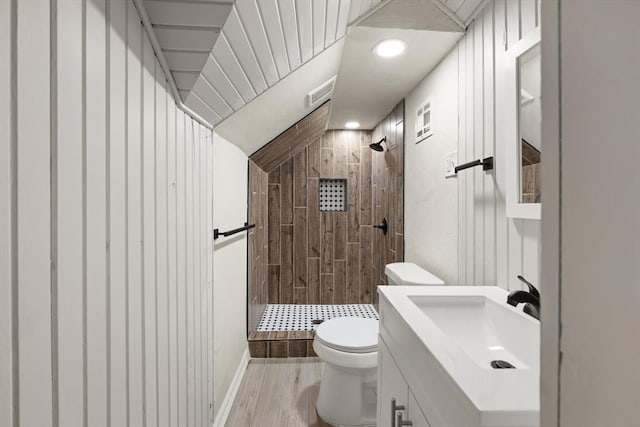 2525 NW 32nd St, Oklahoma City, OK 73112 - full bath with tiled shower, wood finished floors, vanity, and recessed lighting