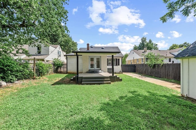 2525 NW 32nd St, Oklahoma City, OK 73112 - back of house featuring french doors, a fenced backyard, and a wooden deck
