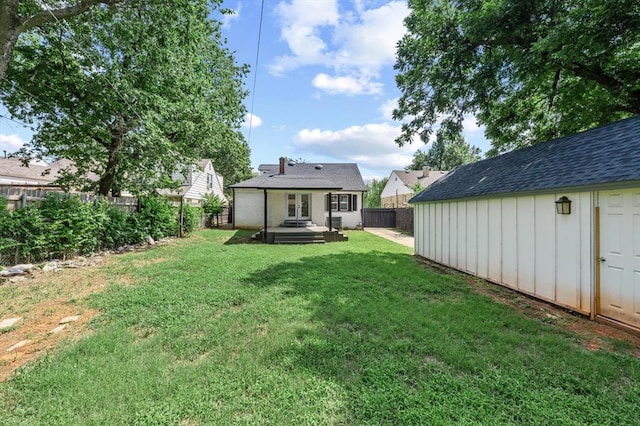 2525 NW 32nd St, Oklahoma City, OK 73112 - fenced backyard with french doors and an outdoor structure