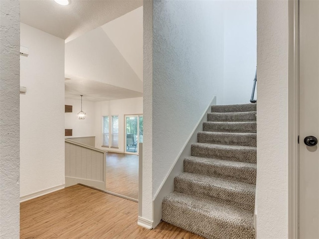 1404 Mary Lee Ln, Edmond, OK 73034 - stairs with wood finished floors and a textured wall