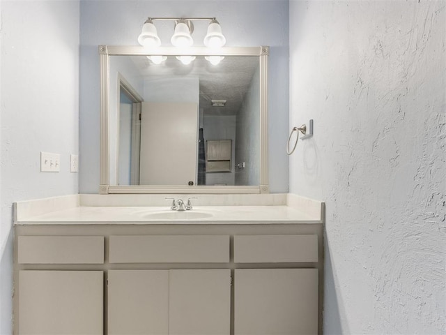 1404 Mary Lee Ln, Edmond, OK 73034 - bathroom featuring vanity and a textured wall
