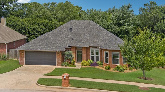 1241 NW 183rd St, Edmond, OK 73012 - view of front of property featuring brick siding, a garage, driveway, and a shingled roof