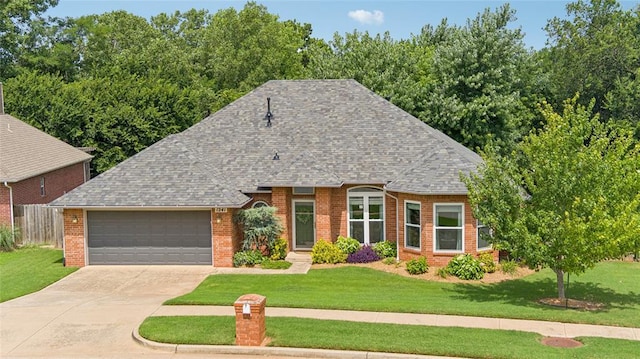 1241 NW 183rd St, Edmond, OK 73012 - view of front of home with brick siding, an attached garage, roof with shingles, and driveway