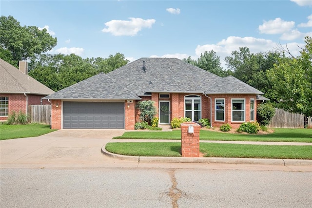 1241 NW 183rd St, Edmond, OK 73012 - view of front facade featuring brick siding, a garage, driveway, and a shingled roof