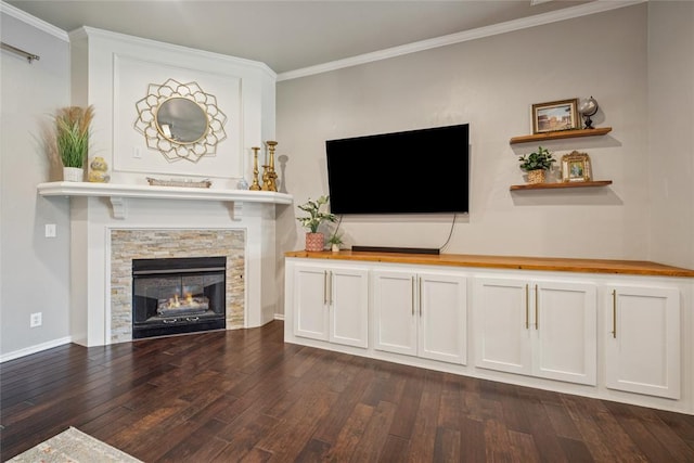 1241 NW 183rd St, Edmond, OK 73012 - living area with dark wood-type flooring, crown molding, and a stone fireplace
