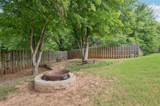 1241 NW 183rd St, Edmond, OK 73012 - fenced backyard featuring an outdoor fire pit