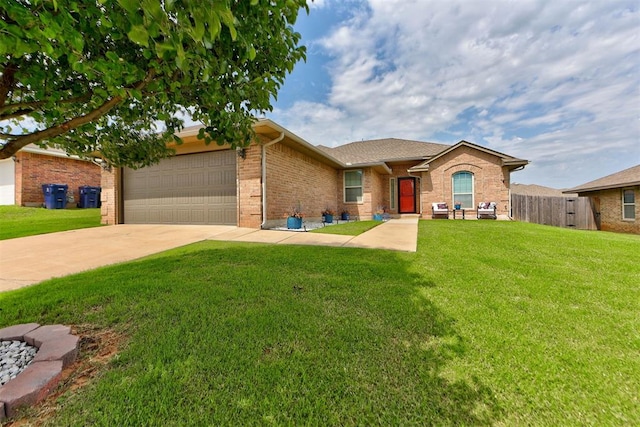 9909 Summerhill Ln, Yukon, OK 73099 - ranch-style home with a garage, brick siding, and driveway