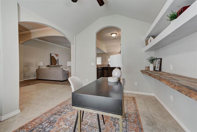 9909 Summerhill Ln, Yukon, OK 73099 - dining room with light tile patterned flooring, a ceiling fan, vaulted ceiling, and arched walkways