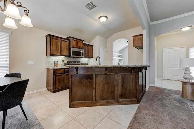9909 Summerhill Ln, Yukon, OK 73099 - kitchen with appliances with stainless steel finishes, light tile patterned floors, ceiling fan, light stone countertops, and hanging light fixtures
