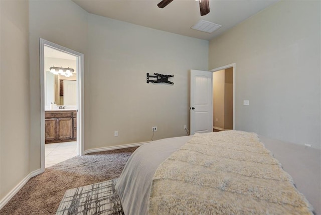 9909 Summerhill Ln, Yukon, OK 73099 - carpeted bedroom featuring connected bathroom and a ceiling fan