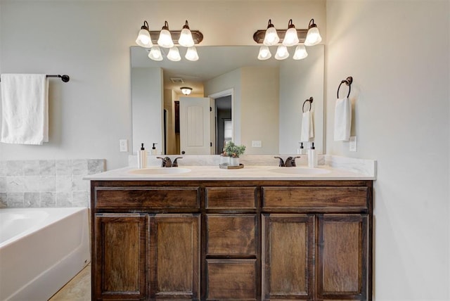 9909 Summerhill Ln, Yukon, OK 73099 - bathroom featuring double vanity and a bath