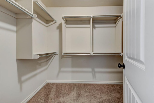 9909 Summerhill Ln, Yukon, OK 73099 - spacious closet featuring carpet flooring