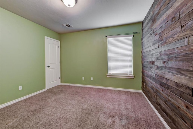 9909 Summerhill Ln, Yukon, OK 73099 - spare room featuring wood walls and carpet floors