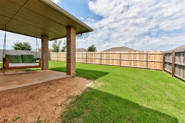 9909 Summerhill Ln, Yukon, OK 73099 - fenced backyard with a patio