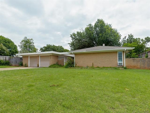 3700 N Edgewater Dr, Oklahoma City, OK 73116 - ranch-style house with a garage, concrete driveway, and brick siding