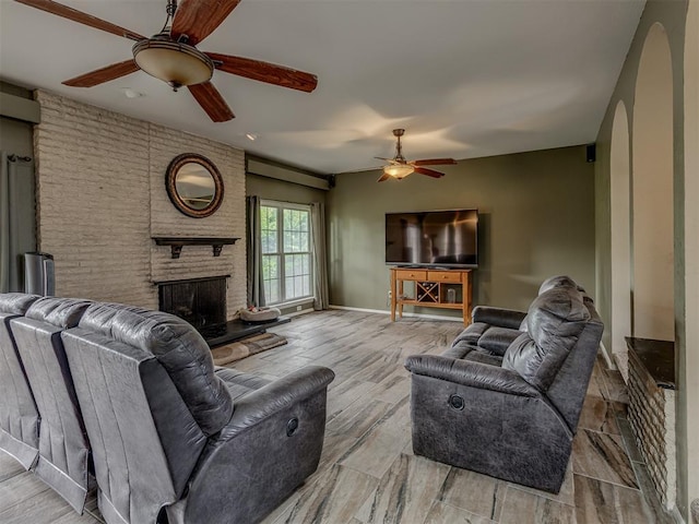 3700 N Edgewater Dr, Oklahoma City, OK 73116 - living room featuring a ceiling fan, a brick fireplace, and wood finished floors