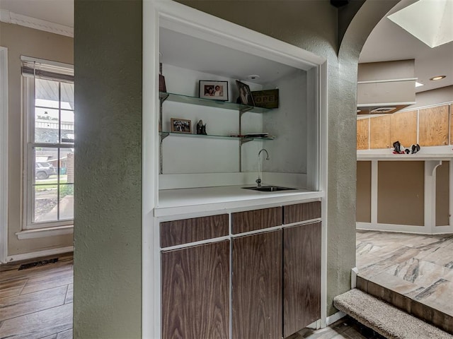 3700 N Edgewater Dr, Oklahoma City, OK 73116 - indoor wet bar with a textured wall and arched walkways