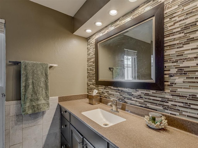3700 N Edgewater Dr, Oklahoma City, OK 73116 - bathroom with vanity, tile walls, recessed lighting, and wainscoting