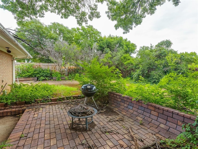 3700 N Edgewater Dr, Oklahoma City, OK 73116 - view of patio / terrace with a fire pit