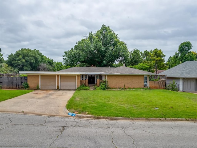 3700 N Edgewater Dr, Oklahoma City, OK 73116 - ranch-style house featuring driveway, an attached garage, and brick siding