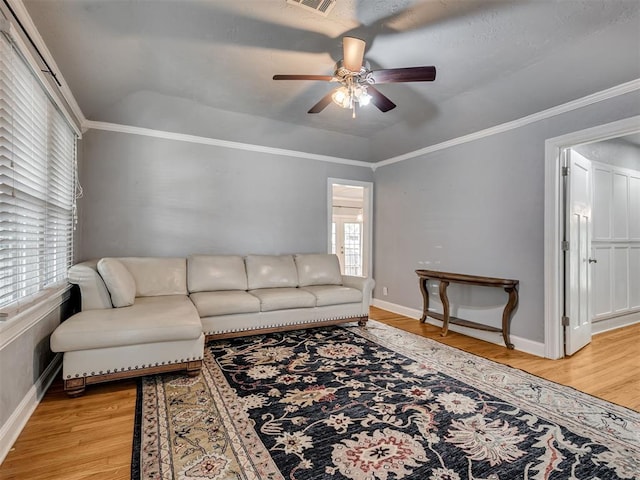 531 NW 48th St, Oklahoma City, OK 73118 - living room featuring light wood-style floors, ceiling fan, and ornamental molding
